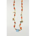 A GLAZED POTTERY AND CARNELIAN AMULET NECKLACE. 16ins long.