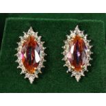 A PAIR OF 9CT GOLD, AZOTIC TOPAZ AND DIAMOND EARRINGS.