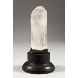 A ROCK CRYSTAL SPECIMEN on an ebonised stand. 6.5ins high inc. stand.