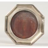 AN OCTAGONAL SILVER PHOTOGRAPH FRAME. Chester 1922. 5.5ins.