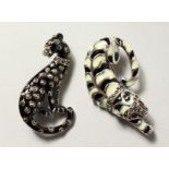 TWO SILVER, MARCASITE AND ENAMEL ART DECO PANTHER BROOCHES.
