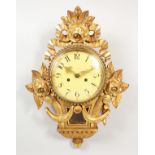 A GILTWOOD CARTEL WALL CLOCK.