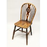 A 19TH CENTURY ASH AND ELM WHEELBACK SIDE CHAIR.