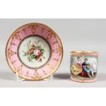 A GOOD SEVRES PINK GROUND CUP AND SAUCER, the cup painted with a boy with guitar, a girl by his side