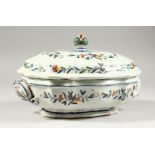 A LATE 19TH CENTURY CONTINENTAL FAIENCE VEGETABLE TUREEN AND COVER, with polychrome decoration.