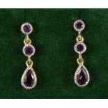 A PAIR OF 9CT GOLD AMETHYST DROP EARRINGS.