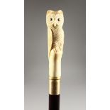 A CARVED BONE HANDLED WALKING STICK, OWL.