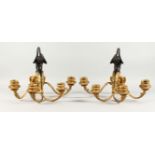 A GOOD PAIR OF LATE 19TH CENTURY GILT AND PATINATED BRONZE WALL LIGHTS, with ornate back-plates,