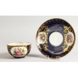 A VIENNA RICH BLUE CUP AND SAUCER with vignettes of figures.