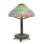 A Tiffany Studios leaded glass and bronze table lamp