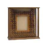 A chip-carved tramp art frame