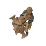 A partially-glazed Italian terra cotta putto