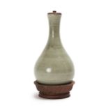 A Chinese celadon vase on stand