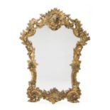 An elaborately-carved giltwood mirror