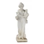 A carved white marble garden sculpture of a woman