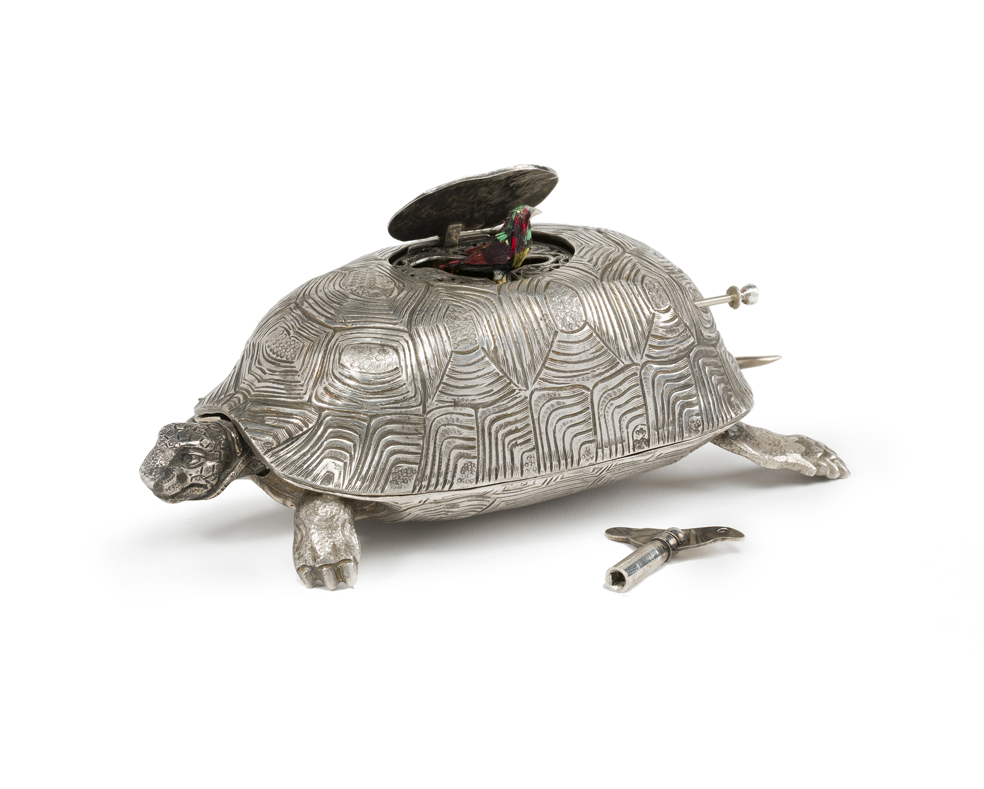 A silver turtle-form singing bird music box
