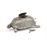 A silver turtle-form singing bird music box