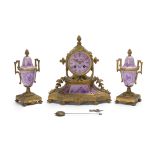 A French gilt-bronze and painted porcelain clock and garniture