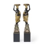 A pair of carved Venetian blackamore figures