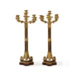 A pair of French gilt-bronze and rouge marble candelabra