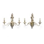 A pair of French silvered-bronze three-light sconces