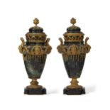 A pair of French marble and gilt-bronze lidded urns