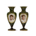 A pair of green Bohemian glass portrait vases