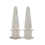 A pair of hand-carved and polished rock crystal obelisks