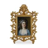 A framed painted porcelain portrait plaque