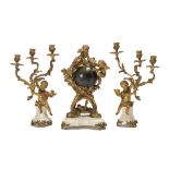 A French Louis XV-style gilt-bronze and white marble orbital clock and garniture set