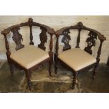 2 late 19th century heavily carved corner chairs
