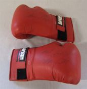 Pair of red leather boxing gloves signed by Jim Watt (b.1948) Scottish boxer and Commentator