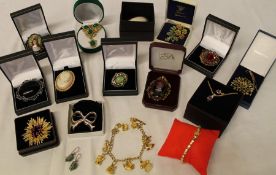 Selection of costume jewellery brooches, pair of silver earrings etc.