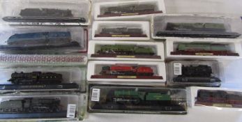 13 boxed collectable die cast model trains on plinths