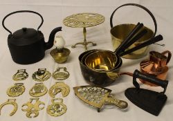 Selection of brass saucepans, horse brasses, squirrel trivet, kettle etc.