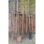 Collection of agricultural hand tools inc dyking spades, pitch forks, bull nose ring pole (some