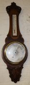 Edwardian carved oak aneroid barometer & thermometer