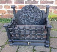 Cast iron fire grate with figural fire back 41cm wide, 27.5cm deep, 36cm at highest point