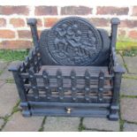 Cast iron fire grate with figural fire back 41cm wide, 27.5cm deep, 36cm at highest point