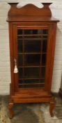 Edwardian mahogany music cabinet on a stand