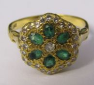 18ct gold six stone emerald and multi set diamond cluster ring size P/Q weight 4.7 g