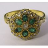 18ct gold six stone emerald and multi set diamond cluster ring size P/Q weight 4.7 g