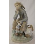 Lladro girl with picnic basket holding doll, height 23cm
