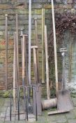 Collection of vintage hand tools including bull nose ring pole, pitch forks etc (some woodworm)