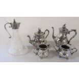 Silver plated ornate 4 piece tea set & a claret jug