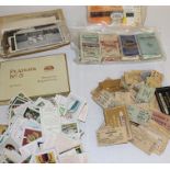 Selection of cigarette cards, boxes, old railway tickets, ration books, black and white photos etc.