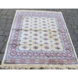 Gold ground cashmere rug with traditional bokhara design 1.7m by 1.2m