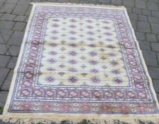 Gold ground cashmere rug with traditional bokhara design 1.7m by 1.2m