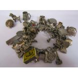 Silver charm bracelet with silver and white metal charms total weight 134.8 g / 4.33 ozt inc match