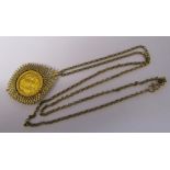 9ct gold chain with George V half sovereign dated 1903 in 9ct gold mount total weight 15.4 g